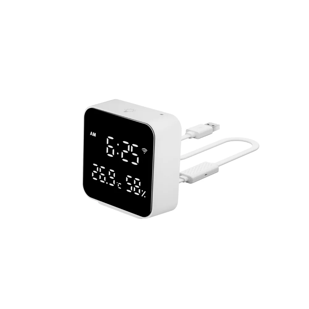 Cihazın açılı görünümü, üst yüzeyinde ışık sensörü simgesi, arkasından çıkan USB kablonun üzerinde delikli sıcaklık ve nem sensörü kapsülü, ucunda USB fişi